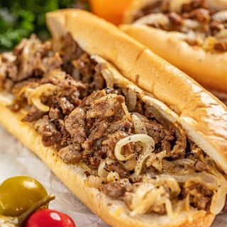 Chicken or Beef Cheesesteak w/ French Fries